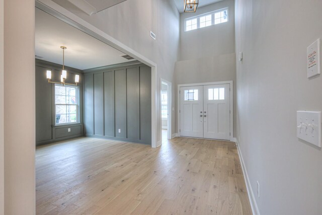 4016 Runyan Cv, Murfreesboro, TN 37127 - entrance foyer with a chandelier, plenty of natural light, and light wood finished floors