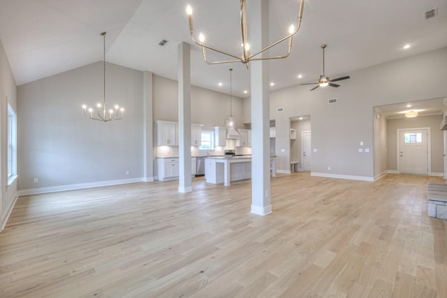 5560 Sinclair Ct, Murfreesboro, TN 37127 - unfurnished living room with a chandelier, high vaulted ceiling, healthy amount of natural light, ceiling fan, and light wood finished floors