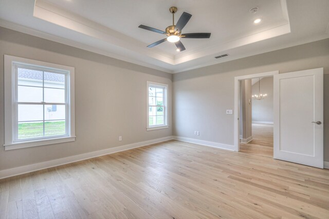 5560 Sinclair Ct, Murfreesboro, TN 37127 - empty room featuring a tray ceiling, ornamental molding, healthy amount of natural light, light wood finished floors, and recessed lighting