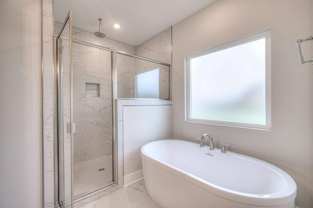 5560 Sinclair Ct, Murfreesboro, TN 37127 - bathroom with marble look tile flooring, a marble finish shower, a freestanding tub, and recessed lighting