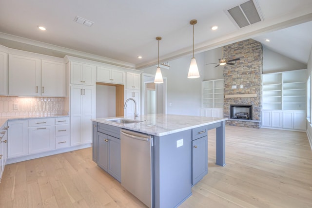 4113 Cile Ct, Murfreesboro, TN 37127 - kitchen featuring stainless steel dishwasher, white cabinets, light wood-type flooring, ceiling fan, and light stone countertops