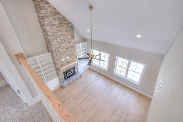 4113 Cile Ct, Murfreesboro, TN 37127 - unfurnished living room featuring a stone fireplace, lofted ceiling, a ceiling fan, light wood finished floors, and recessed lighting