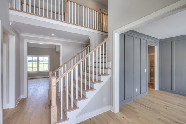 4113 Cile Ct, Murfreesboro, TN 37127 - stairs featuring wood finished floors, ornamental molding, and a decorative wall