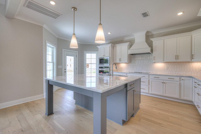 4113 Cile Ct, Murfreesboro, TN 37127 - kitchen with custom range hood, appliances with stainless steel finishes, backsplash, white cabinets, and ornamental molding
