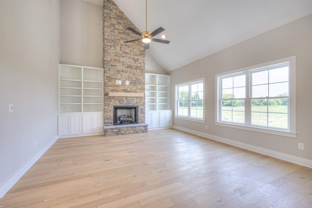 4113 Cile Ct, Murfreesboro, TN 37127 - unfurnished living room featuring a ceiling fan, light wood-style floors, plenty of natural light, high vaulted ceiling, and built in features