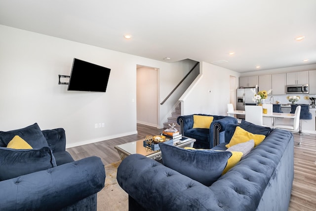 1704 Lannister Ave, Murfreesboro, TN 37128 - living room featuring stairway, light wood-style floors, and recessed lighting
