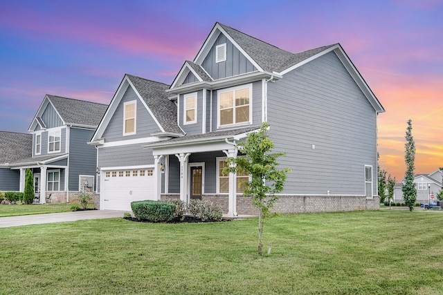 1704 Lannister Ave, Murfreesboro, TN 37128 - view of front facade featuring concrete driveway, a garage, a front yard, board and batten siding, and a porch