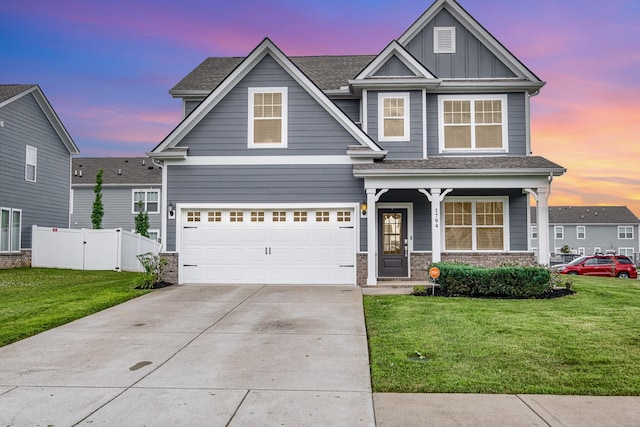 1704 Lannister Ave, Murfreesboro, TN 37128 - view of front of home with driveway, a garage, board and batten siding, and a porch