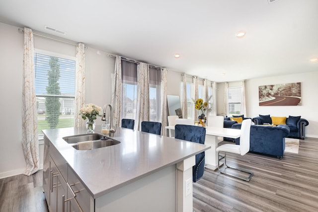 1704 Lannister Ave, Murfreesboro, TN 37128 - kitchen with dark wood-style flooring, a kitchen island with sink, light countertops, recessed lighting, and open floor plan