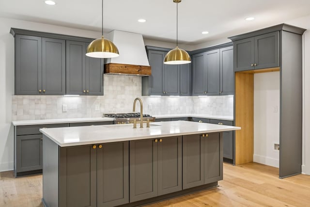 1007 Pheasant Ct, Kingston Springs, TN 37082 - kitchen with premium range hood, light countertops, light wood-style flooring, and recessed lighting