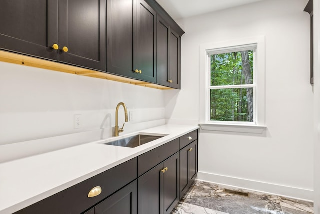 1007 Pheasant Ct, Kingston Springs, TN 37082 - kitchen with light countertops and light marble finish flooring