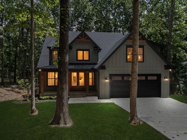 1007 Pheasant Ct, Kingston Springs, TN 37082 - modern inspired farmhouse with concrete driveway, board and batten siding, a porch, a standing seam roof, and a front lawn