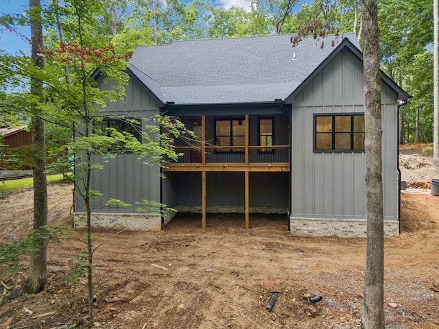 1007 Pheasant Ct, Kingston Springs, TN 37082 - back of house featuring roof with shingles, board and batten siding, and a wooden deck