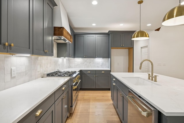 1007 Pheasant Ct, Kingston Springs, TN 37082 - kitchen featuring appliances with stainless steel finishes, premium range hood, light wood-style floors, recessed lighting, and a kitchen island with sink
