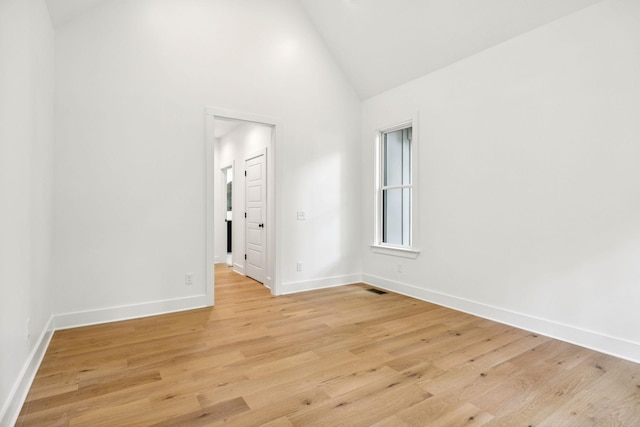 1007 Pheasant Ct, Kingston Springs, TN 37082 - spare room with high vaulted ceiling and light wood finished floors
