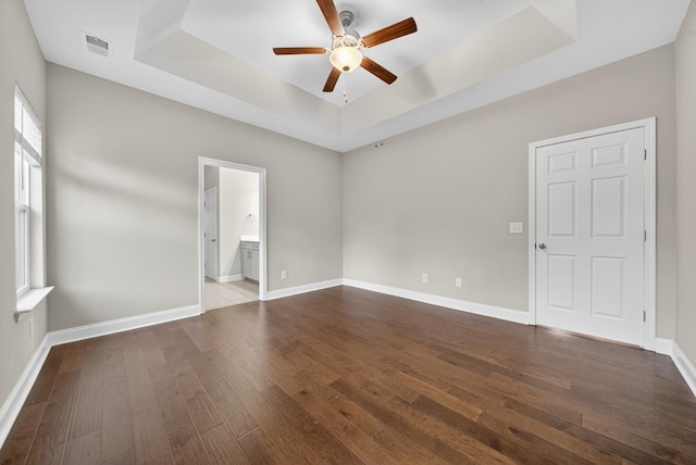 751 Pebble Creek Ln, Lebanon, TN 37090 - unfurnished room featuring a raised ceiling, a ceiling fan, and dark wood-style floors