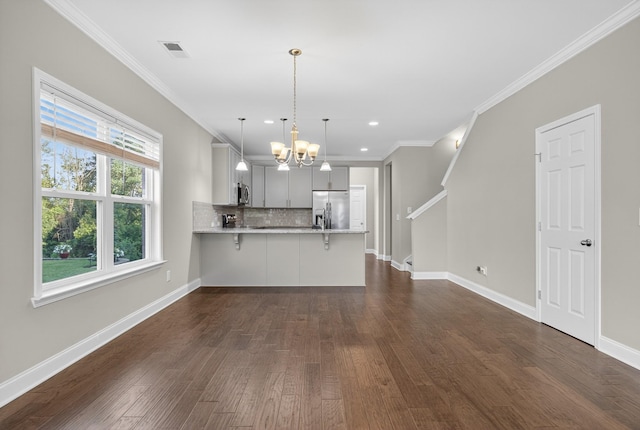 751 Pebble Creek Ln, Lebanon, TN 37090 - kitchen featuring stainless steel appliances, a peninsula, backsplash, a chandelier, and dark wood finished floors