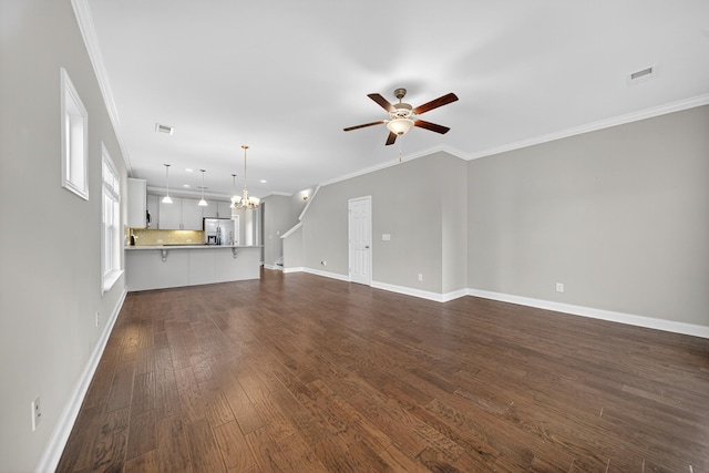 751 Pebble Creek Ln, Lebanon, TN 37090 - unfurnished living room with a ceiling fan, a chandelier, dark wood-style flooring, ornamental molding, and recessed lighting
