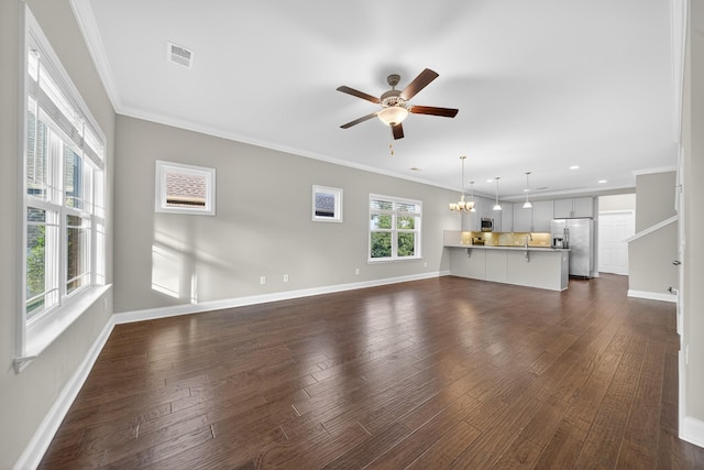 751 Pebble Creek Ln, Lebanon, TN 37090 - unfurnished living room with a ceiling fan, a chandelier, ornamental molding, dark wood-type flooring, and recessed lighting