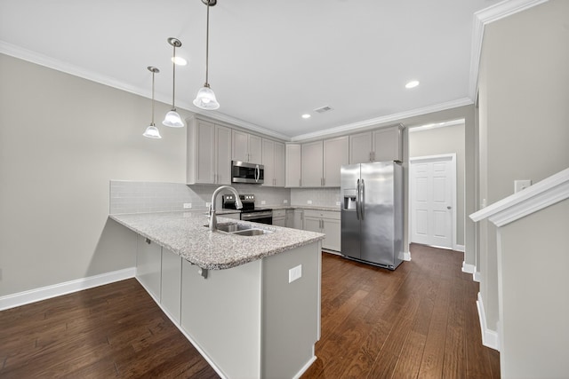 751 Pebble Creek Ln, Lebanon, TN 37090 - kitchen featuring appliances with stainless steel finishes, ornamental molding, a peninsula, backsplash, and light stone countertops