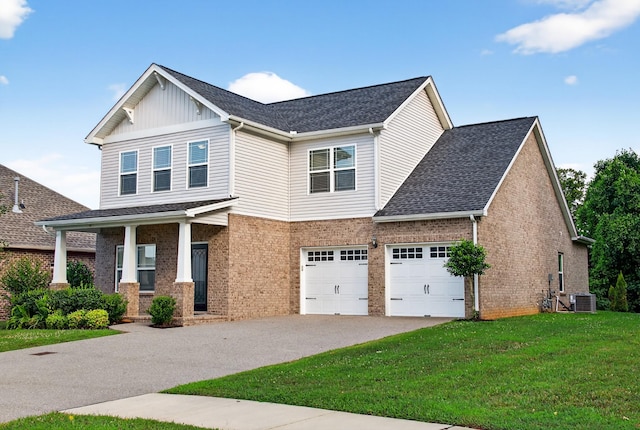 751 Pebble Creek Ln, Lebanon, TN 37090 - craftsman-style house with roof with shingles, brick siding, a front lawn, asphalt driveway, and board and batten siding