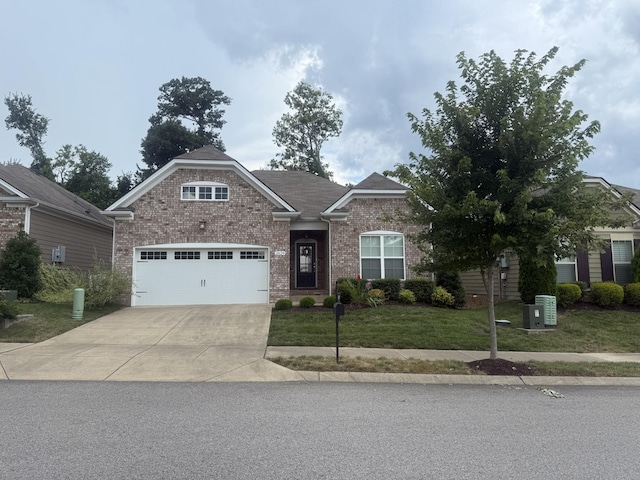 2629 Conti Dr, Columbia, TN 38401 - view of front of home with driveway, a front yard, brick siding, and an attached garage