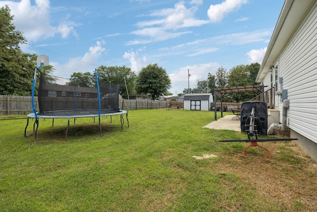 906 Freeman St, Lafayette, TN 37083 - fenced backyard featuring a trampoline, a shed, and a patio