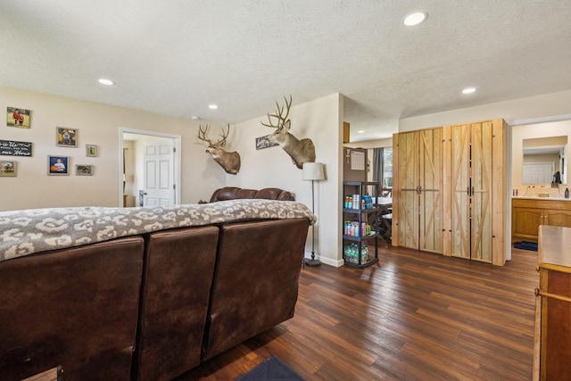 906 Freeman St, Lafayette, TN 37083 - bedroom featuring dark wood-style floors, recessed lighting, and a textured ceiling