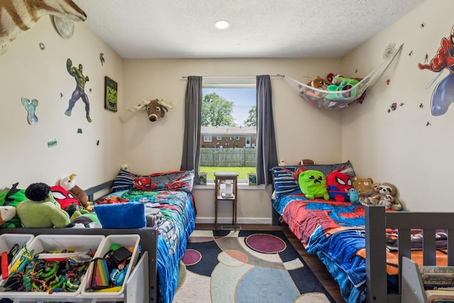 906 Freeman St, Lafayette, TN 37083 - bedroom with a textured ceiling, recessed lighting, and wood finished floors