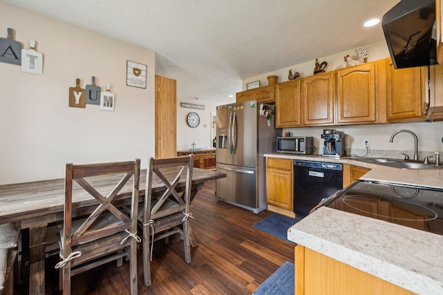 906 Freeman St, Lafayette, TN 37083 - kitchen featuring black appliances, dark wood-type flooring, brown cabinetry, light countertops, and a textured ceiling