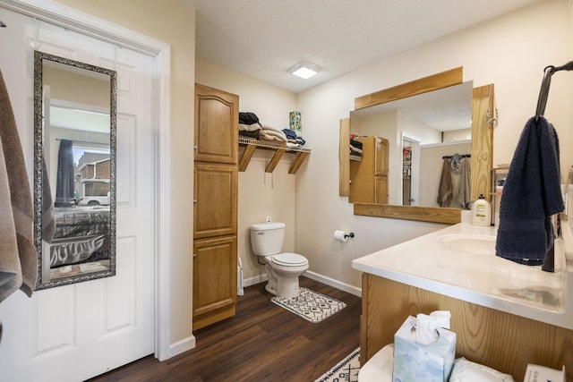 906 Freeman St, Lafayette, TN 37083 - bathroom featuring wood finished floors, vanity, and a textured ceiling