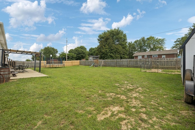 906 Freeman St, Lafayette, TN 37083 - fenced backyard with a trampoline, a playground, and a patio area
