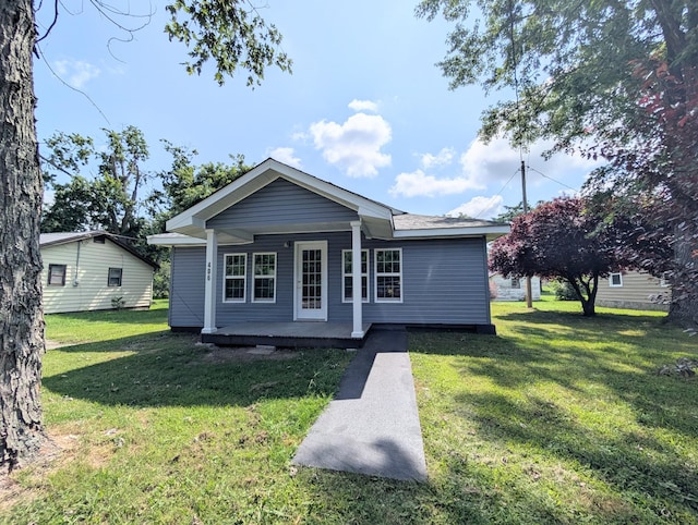 406 Horton St, Decherd, TN 37324 - back of house with a porch and a lawn