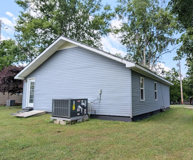 406 Horton St, Decherd, TN 37324 - view of side of property with a cooling unit and a yard