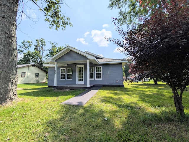 406 Horton St, Decherd, TN 37324 - back of property featuring a porch and a lawn
