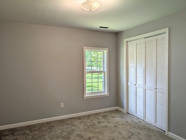 406 Horton St, Decherd, TN 37324 - unfurnished bedroom with carpet floors and a closet