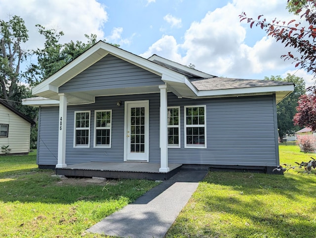 406 Horton St, Decherd, TN 37324 - view of front facade featuring covered porch and a front yard