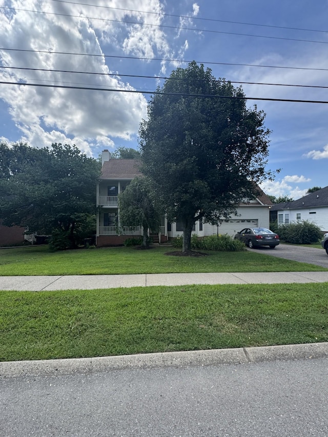 294 Buckingham Blvd, Gallatin, TN 37066 - obstructed view of property featuring a front lawn and a chimney