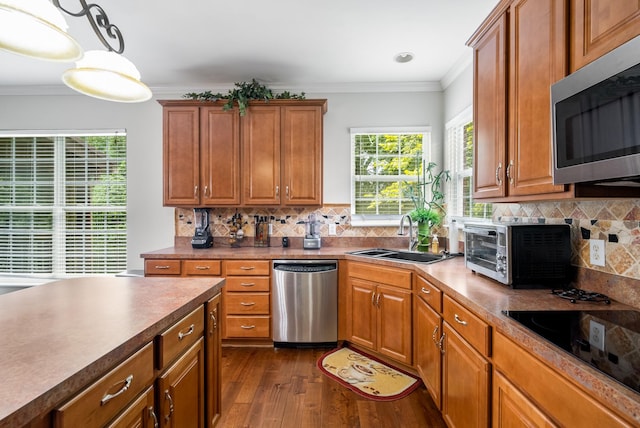 4305 Minette Ct, Mount Juliet, TN 37122 - kitchen featuring appliances with stainless steel finishes, crown molding, dark wood-type flooring, tasteful backsplash, and brown cabinets