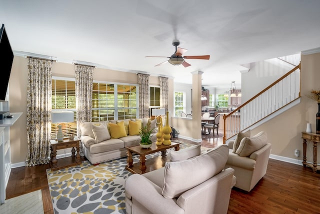 4305 Minette Ct, Mount Juliet, TN 37122 - living room featuring a ceiling fan, wood finished floors, stairs, a chandelier, and ornate columns