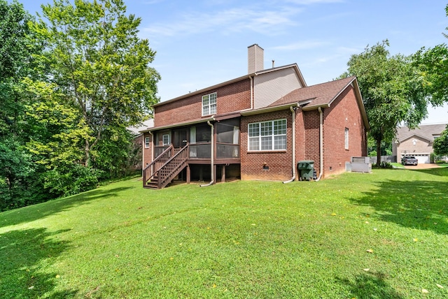 4305 Minette Ct, Mount Juliet, TN 37122 - rear view of house featuring a sunroom, a chimney, brick siding, and a yard