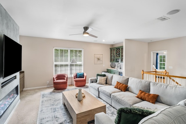 4305 Minette Ct, Mount Juliet, TN 37122 - living area featuring ceiling fan, light colored carpet, and a glass covered fireplace