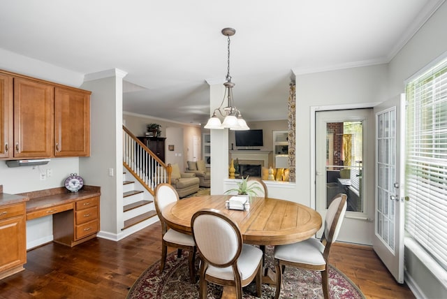 4305 Minette Ct, Mount Juliet, TN 37122 - dining room featuring dark wood-style flooring, a fireplace, crown molding, stairway, and built in desk
