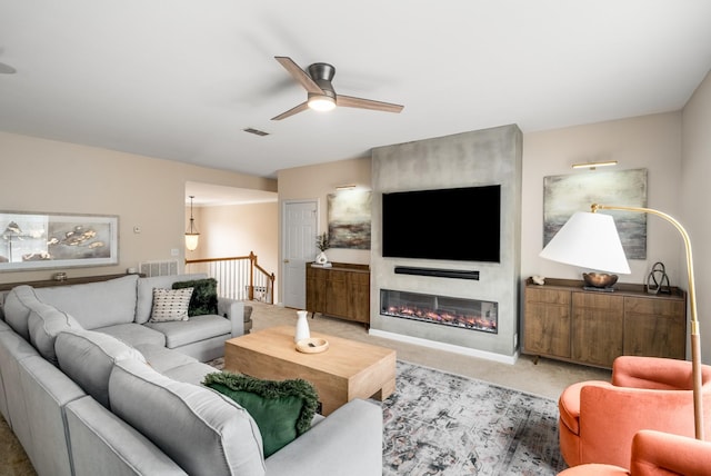 4305 Minette Ct, Mount Juliet, TN 37122 - carpeted living area featuring a ceiling fan and a fireplace