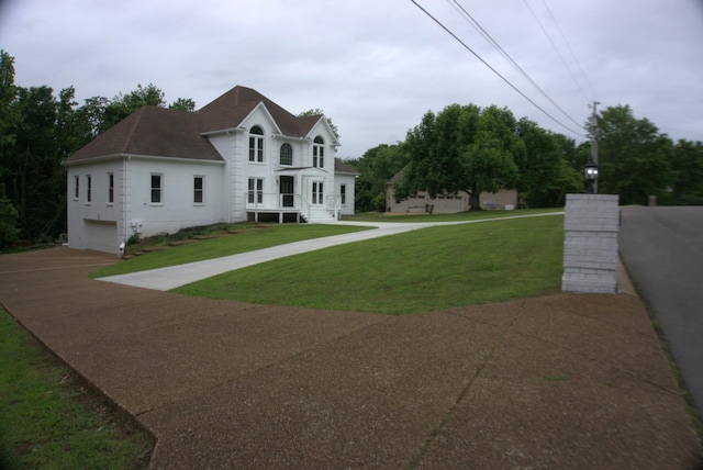 1202 Willow Brook Pass, Mount Juliet, TN 37122 - view of front of property with an attached garage, driveway, a shingled roof, and a front lawn