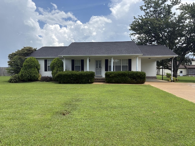 685 Edgefield Dr, Hohenwald, TN 38462 - ranch-style home with an attached carport, concrete driveway, a front lawn, and roof with shingles