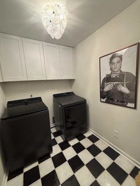 2083 Stokes Ln, Nashville, TN 37215 - washroom featuring cabinet space, washing machine and dryer, and light floors