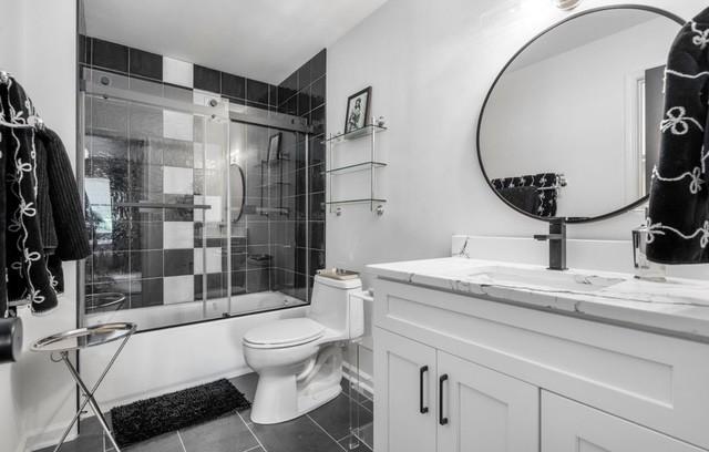 2083 Stokes Ln, Nashville, TN 37215 - bathroom featuring vanity, combined bath / shower with glass door, and tile patterned flooring