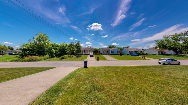 344 Pioneer Dr, Oak Grove, KY 42262 - view of green lawn with a residential view and driveway