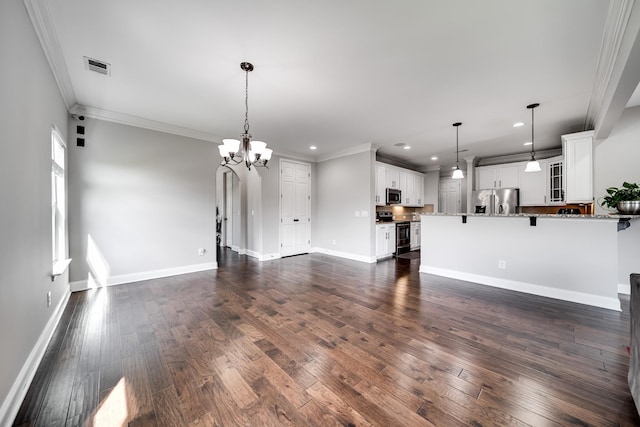 230 Fowler Cir, Franklin, TN 37064 - unfurnished living room featuring a chandelier, recessed lighting, ornamental molding, and dark wood-type flooring